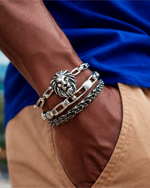 Wrist wearing a lion-head bracelet, for the Lyon office