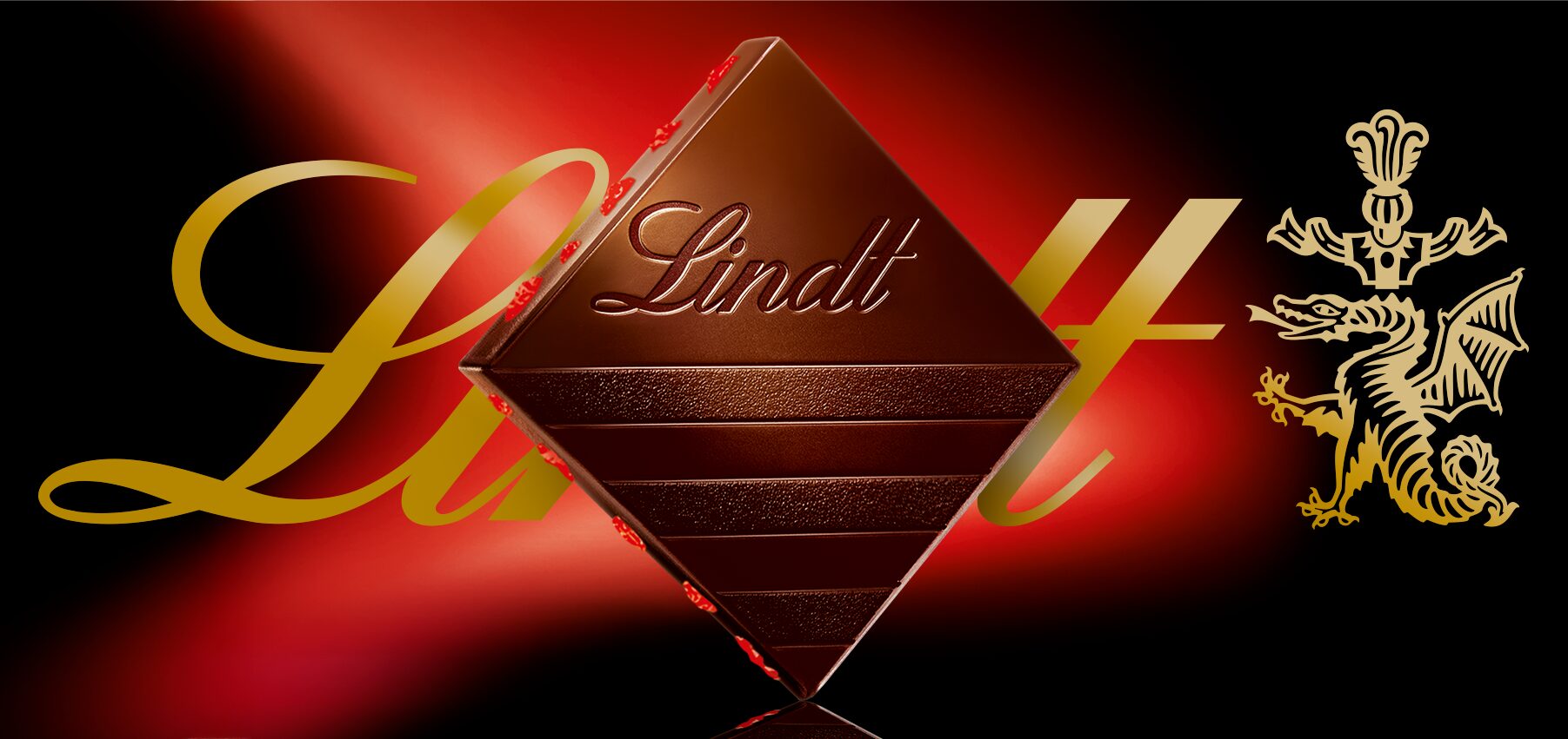 Lindt diamond-shaped chocolate square, gold signature and heraldic emblem on red and black