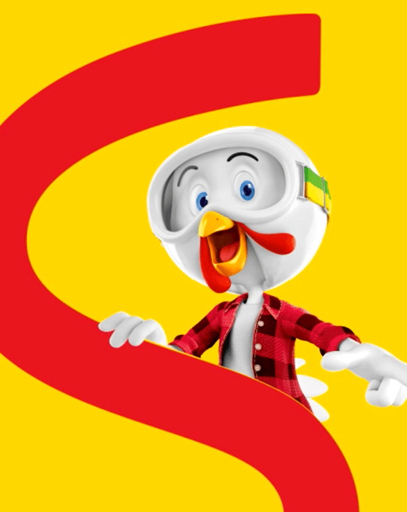 Sadia's chicken mascot in a checked shirt in front of the brand's big red S